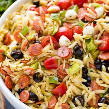Classic Italian orzo pasta salad, complete with a homemade dressing and mini pepperonis. This traditional American pasta salad is great with an orzo pasta twist.