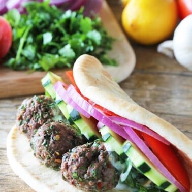 Lamb Meatball gyros on a wooden countertop