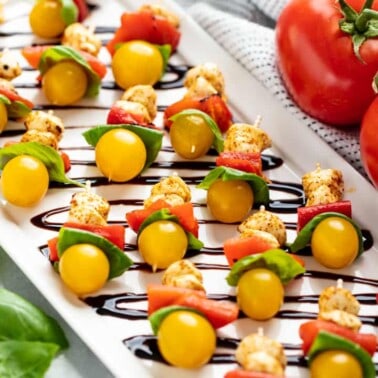 Angled view of Southwestern Caprese Bites on a white serving plate.